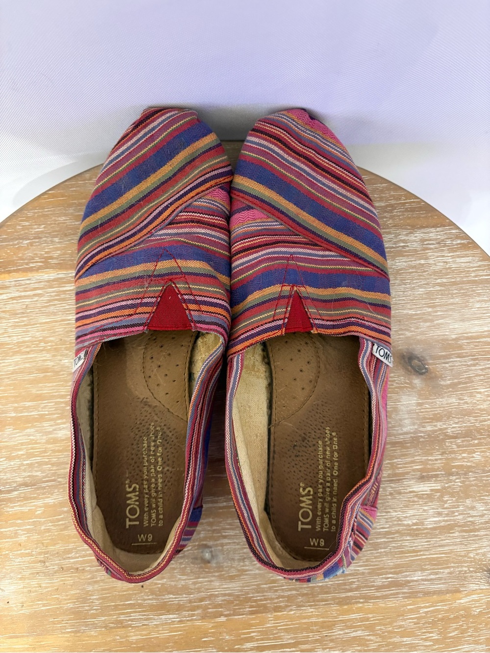 TOMS Women's Multicolor Striped Canvas Slip-Ons with Red Accent